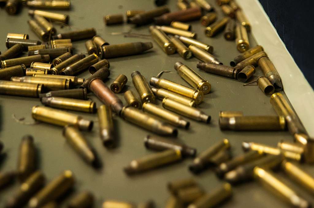 Brass Shell Casings Adorn The Bottom Of A Weapons Showcase - PICRYL ...