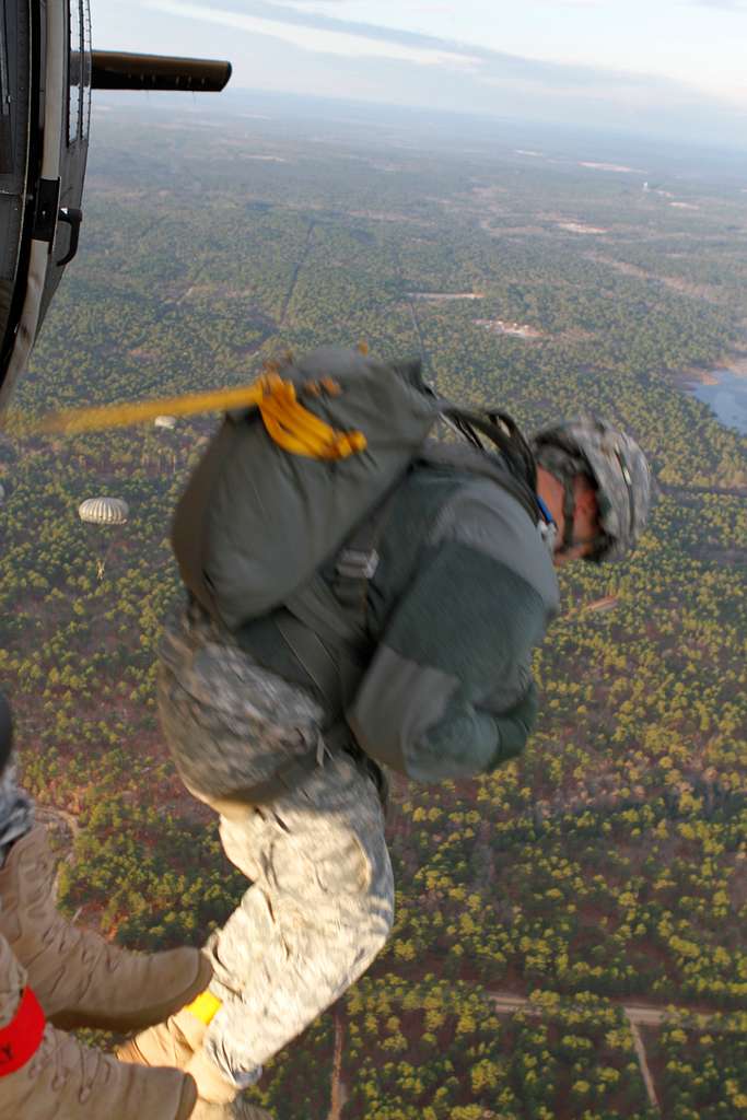 A U.S. Army paratrooper jumps out of a U.S. Army UH-60 - NARA & DVIDS ...