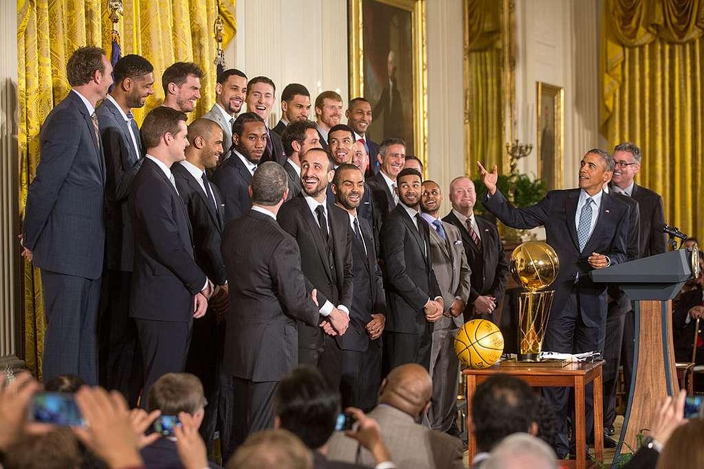 New York Yankees manager Joe Girardi presents US President Barack Obama  with an autographed jersey during an event with the 2009 World Series  champions of Major League Baseball in the East Room