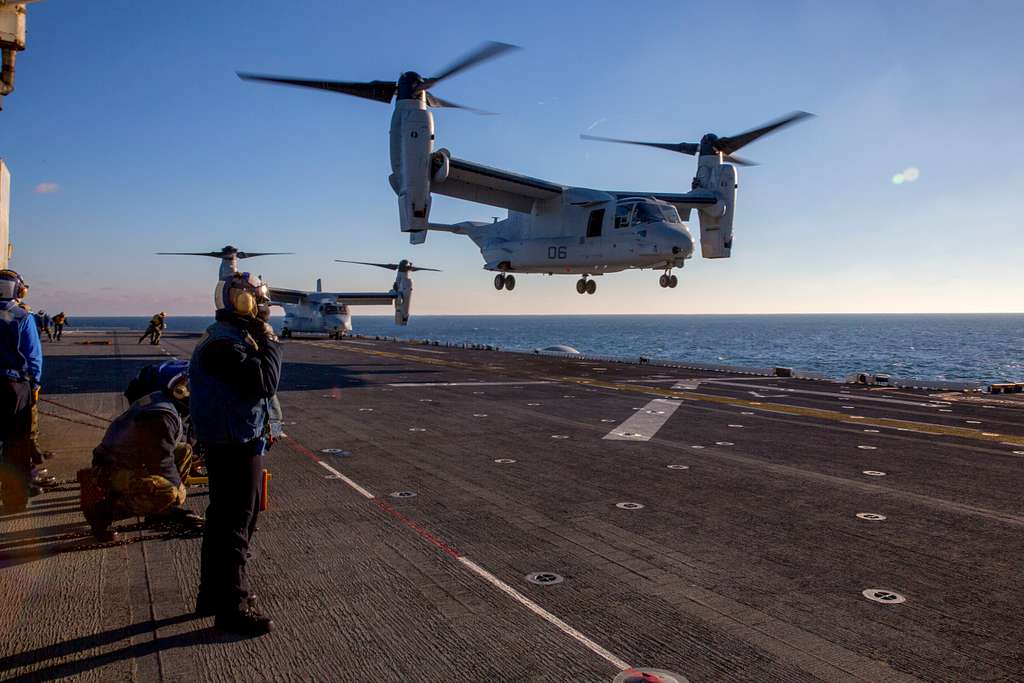 An MV-22 Osprey lands on the flight deck of the amphibious - NARA ...