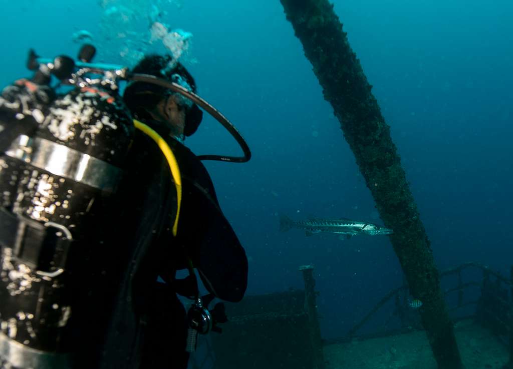 Navy diver ensures a proper seal on the Kirby Morgan 37 di…