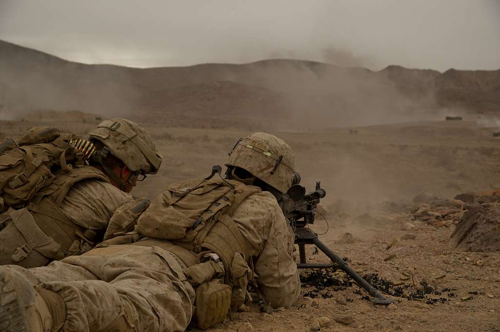 A U.S. Marines fires a M240E machine gun while participating - NARA ...