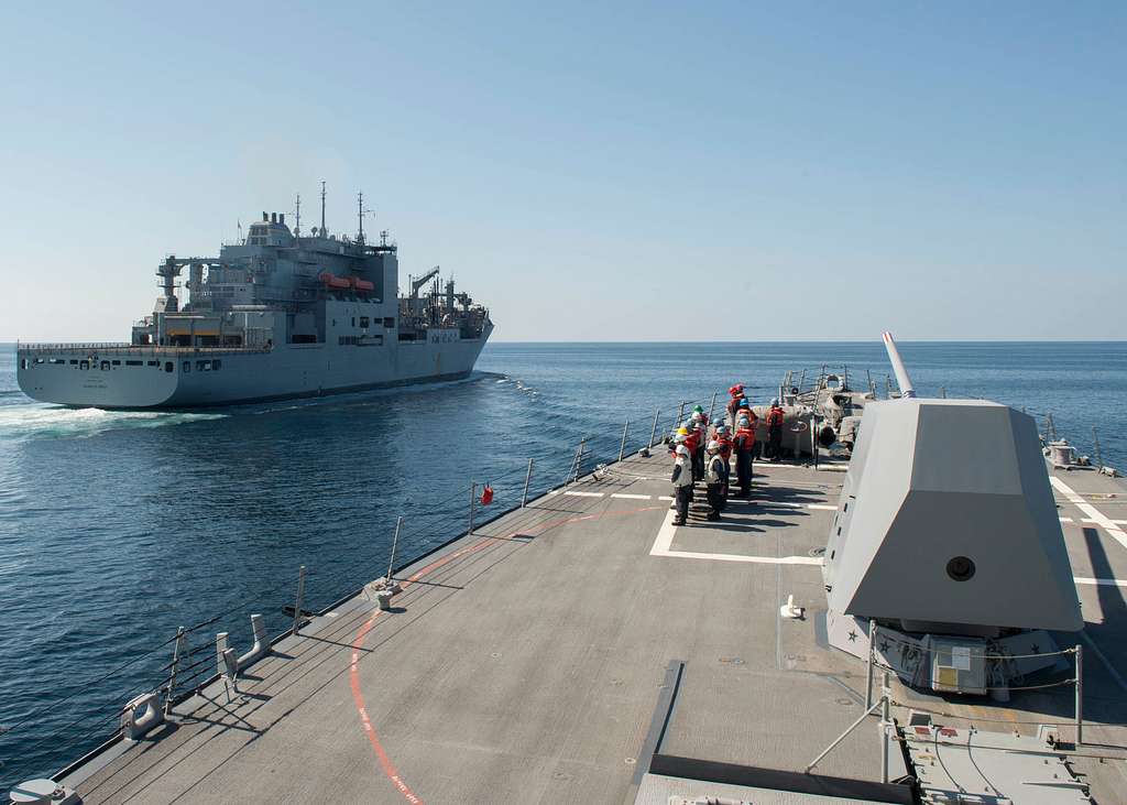 The guided-missile destroyer USS Dewey (DDG 105) pulls - PICRYL ...