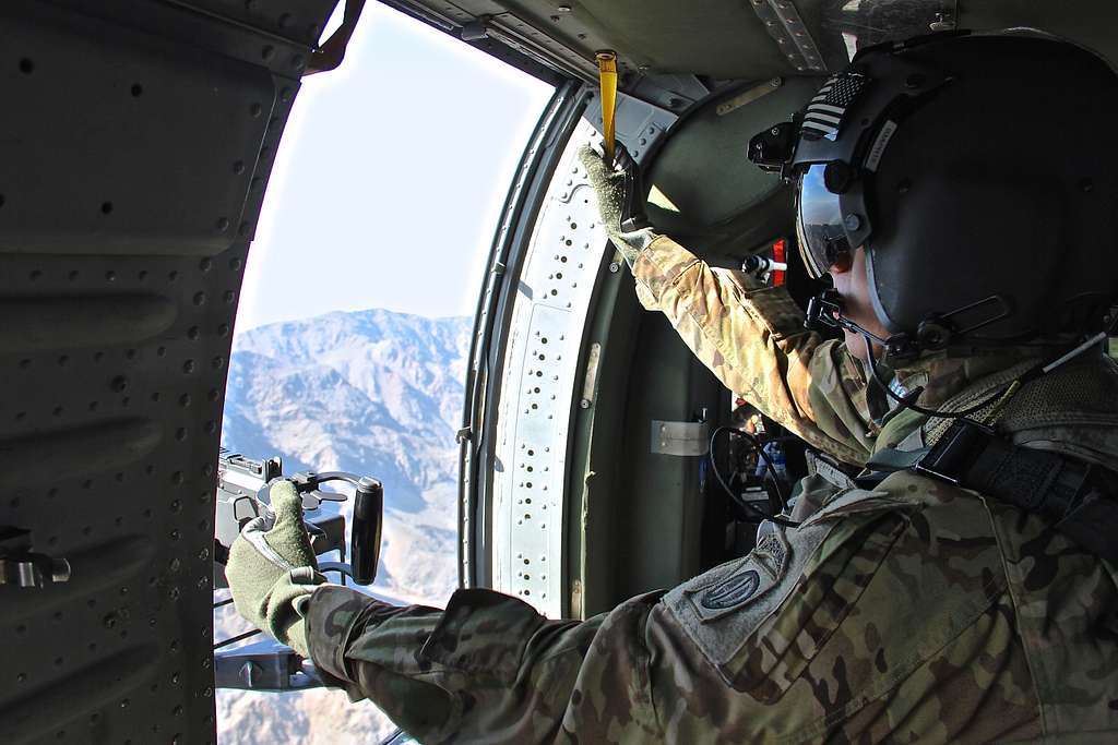 A UH-60 Black Hawk helicopter door gunner, assigned - NARA & DVIDS ...