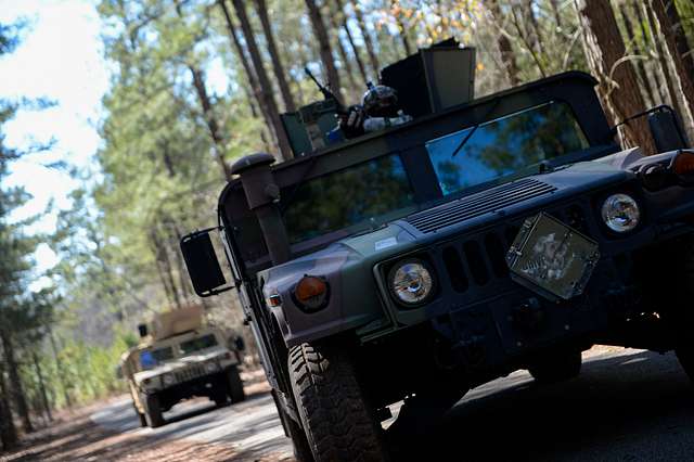 A Humvee convoy provides security for a recovery mission - NARA & DVIDS ...