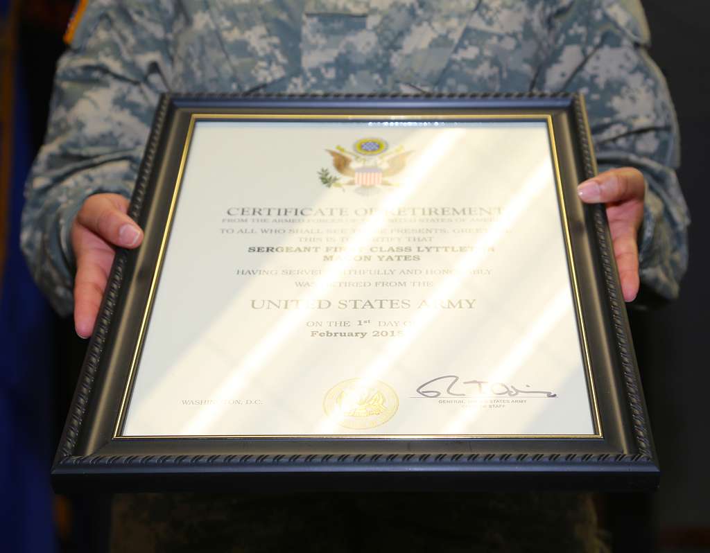 U.S. Army Soldier presents the certificate of retirement - PICRYL ...