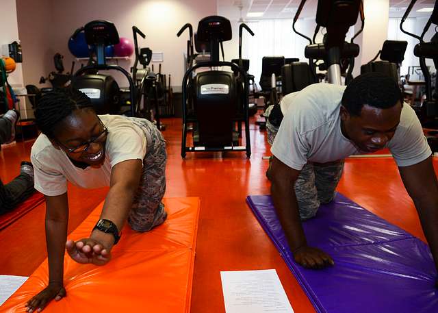 A man in a red shirt doing a push up. Sport fitness exercise, sports. -  PICRYL - Public Domain Media Search Engine Public Domain Search