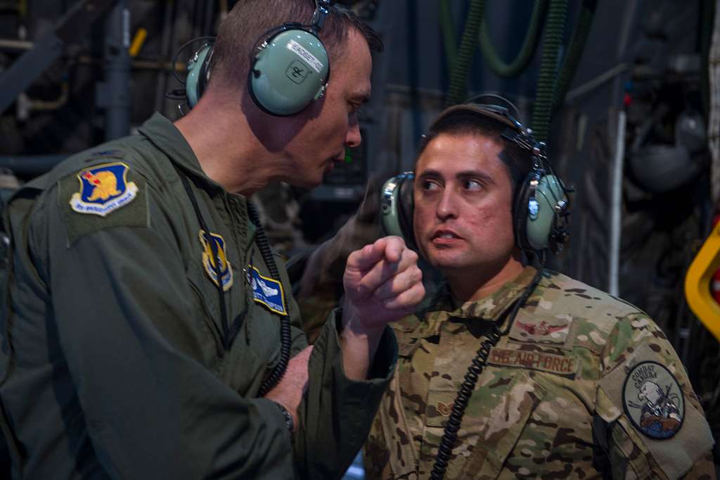 A 4th Special Operations Squadron aerial gunner, right, - NARA & DVIDS ...