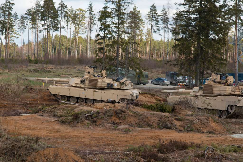 Two M1a2 Abrams Main Battle Tanks Move Into Position Picryl Public Domain Search