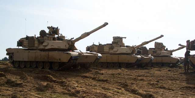 A line of M1A2 Abrams Main Battle Tanks are parked - NARA & DVIDS ...