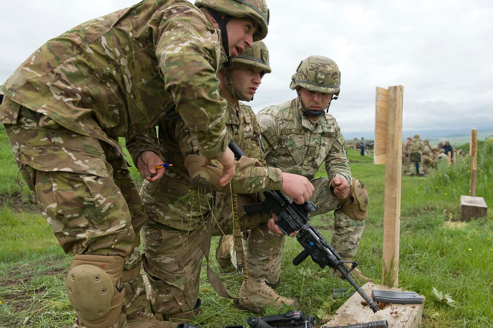 A Georgian soldier adjusts their M4 rifle after checking - NARA & DVIDS ...