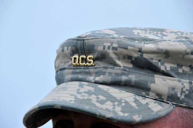 U.S. Army Sgt. 1st Class Joe Baker demonstrates a choke hold on Officer  Candidate Wendy McDougall during combatives training at the Bethany Beach  Training Site in Bethany Beach, Del., June 7, 2015.