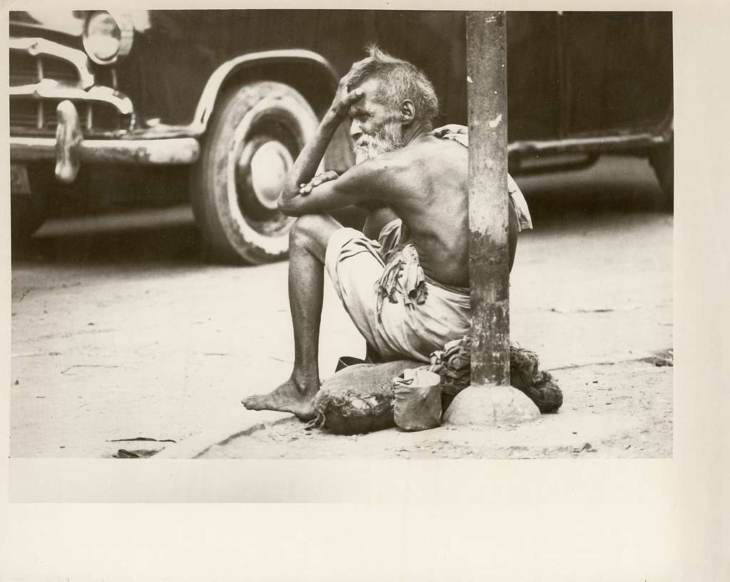 A shirtless older man sitting on a sack on the corner - PICRYL - Public  Domain Media Search Engine Public Domain Search