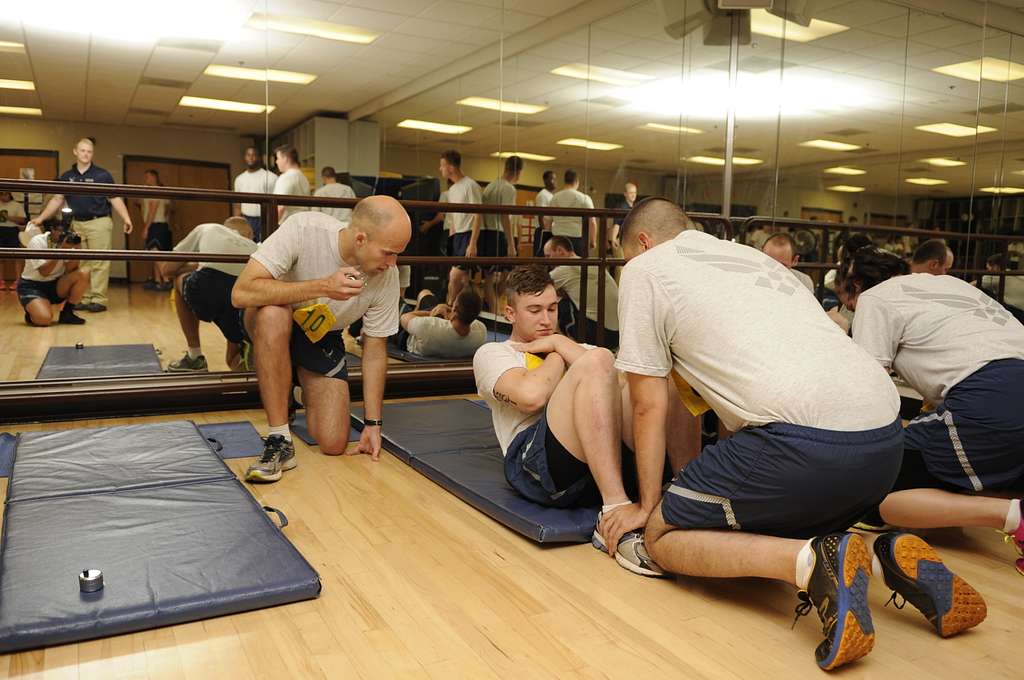 U.S. Air Force Airmen execute the timed sit up portion NARA