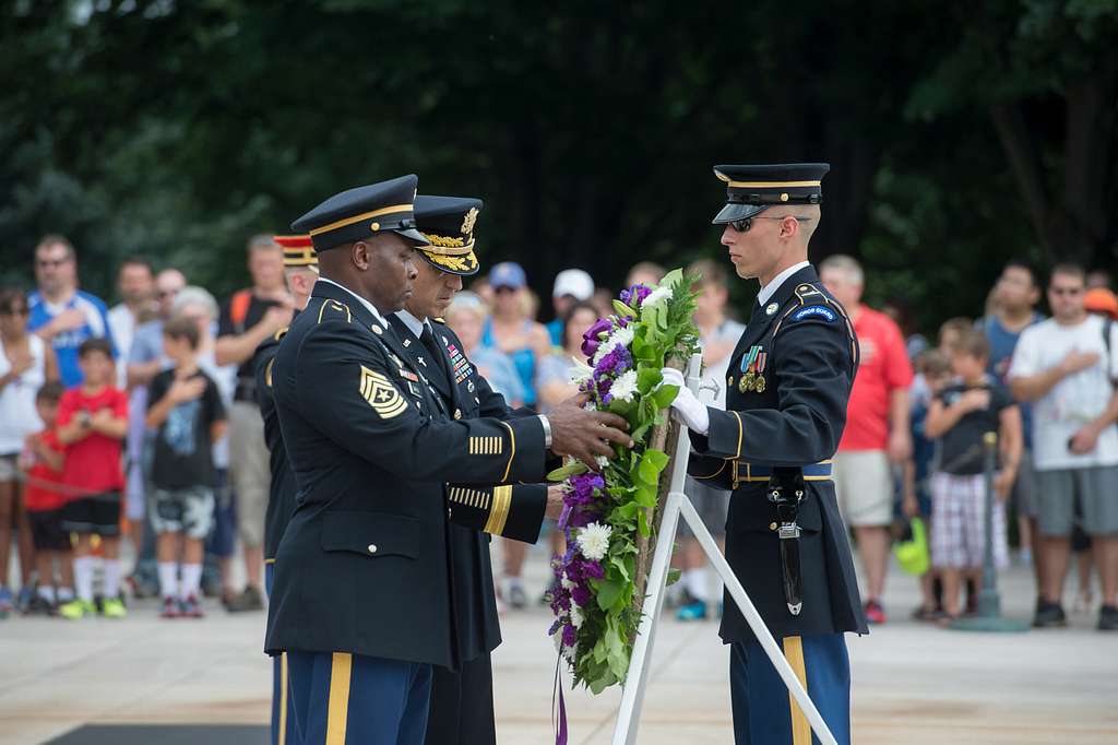 Laurice Clark pins her husband, Chief Master Sgt. Vegas Clark