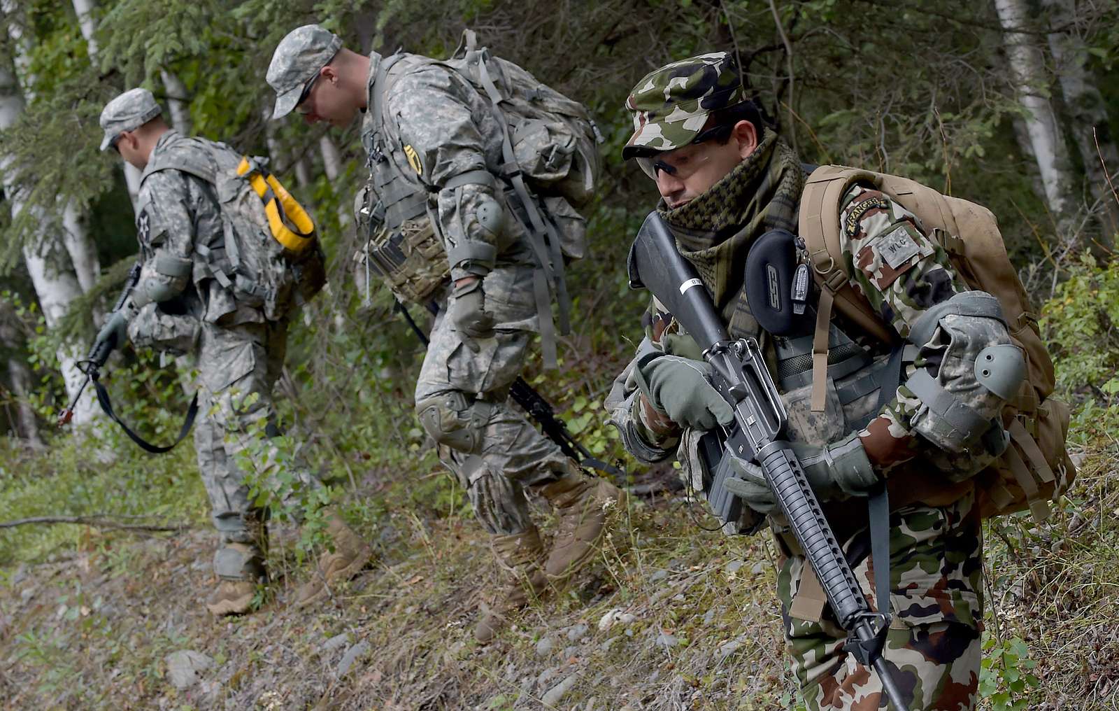 A Nepalese Army Ranger runs down an embankment with - NARA & DVIDS ...