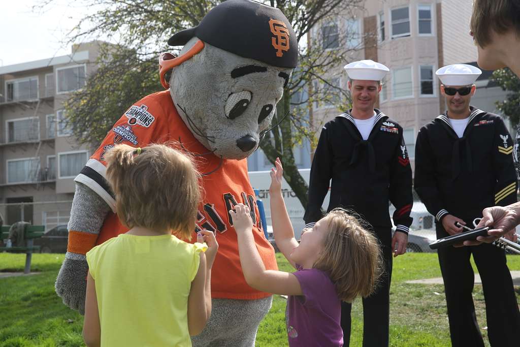 San Francisco Giants mascot Lou Seal, right, stands with his