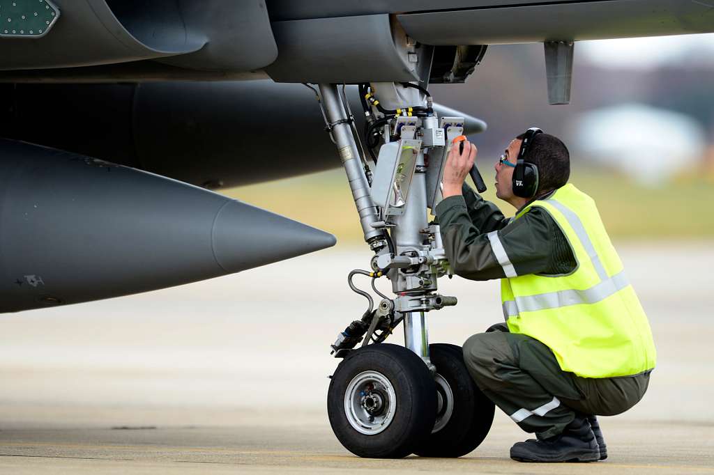 A member of the French Air Force (FrAF) performs post-flight