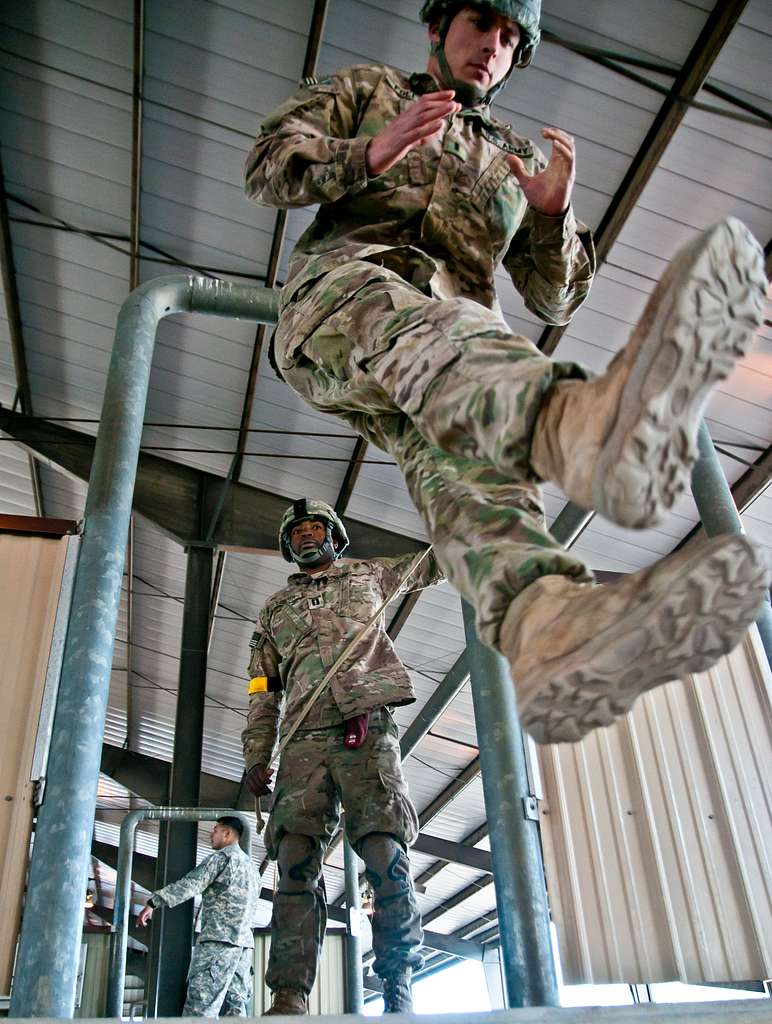 Holding the static line in a “reverse bite,” paratroopers assigned