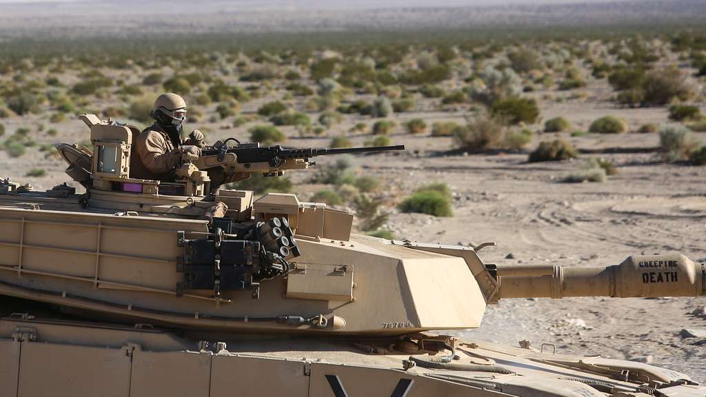 A Marine mans the turret of an M1A1 Abrams tank during - NARA & DVIDS ...