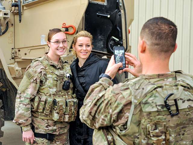 A Task Force Crimson Airman poses for a photo with - PICRYL - Public ...