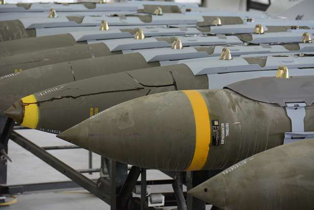 A dozen 2,000-pound joint direct attack munitions sit - NARA & DVIDS ...