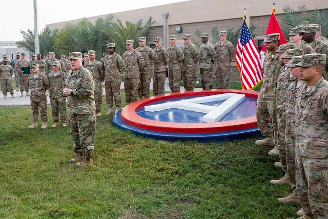 Sgt. Maj. of the Army Daniel A. Dailey poses with Screech, the mascot of  the Washington