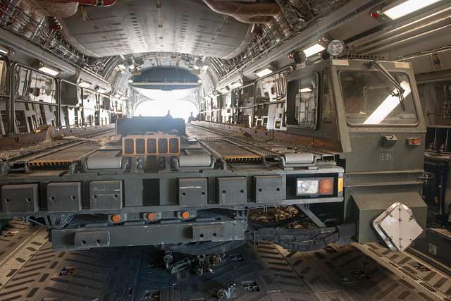 A 60K aircraft loader is loaded in to a C-17 Globemaster - PICRYL ...