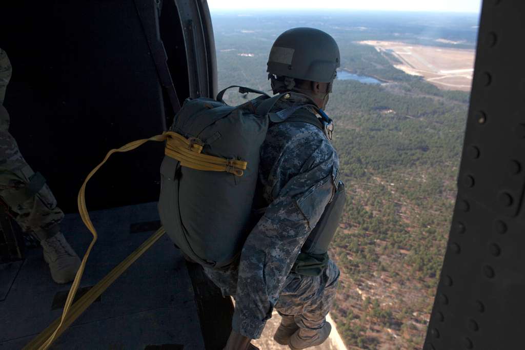 A U.S. Army paratrooper jumps out of a UH-60 Black - NARA & DVIDS ...