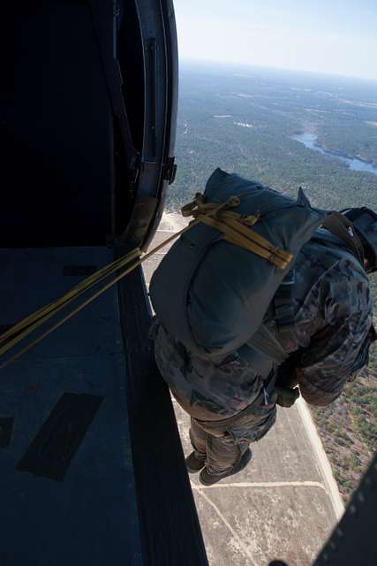 A U.S. Army soldier jumps out of UH-60 Black Hawk during - NARA & DVIDS ...