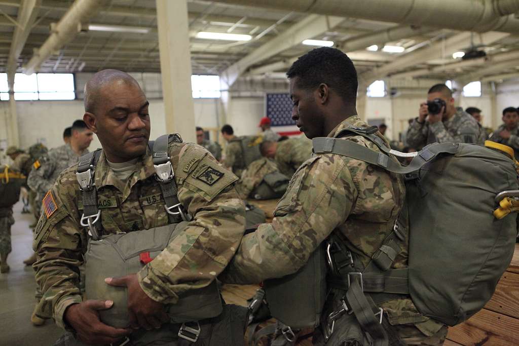 U.S. Army Sgt. Maj. Gary Isaacs is aided by his son - NARA & DVIDS ...