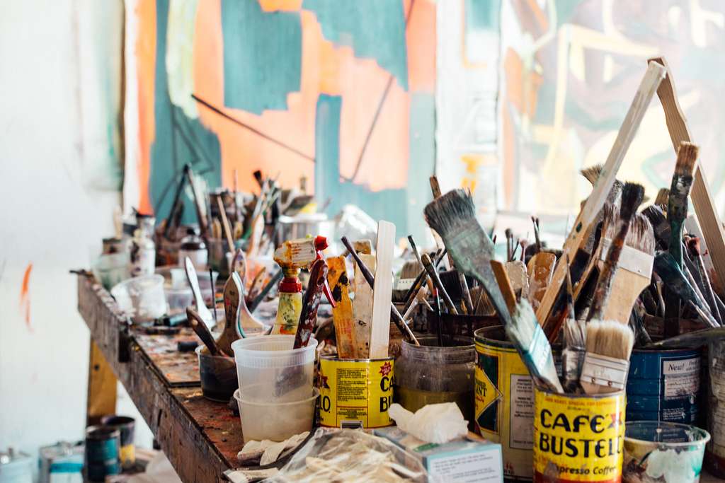 A white table topped with paint and brushes. Paint brushes painting. -  PICRYL - Public Domain Media Search Engine Public Domain Image