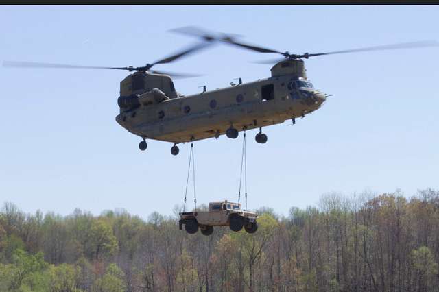 A CH-47 Chinook helicopter transports a Humvee after - NARA & DVIDS ...