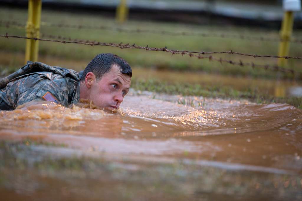 A U.S. Army Ranger completes a water obstacle at the - PICRYL Public ...