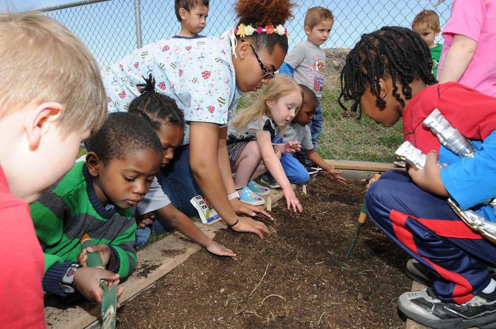 A Child Development Center class huddles around a garden - NARA & DVIDS ...