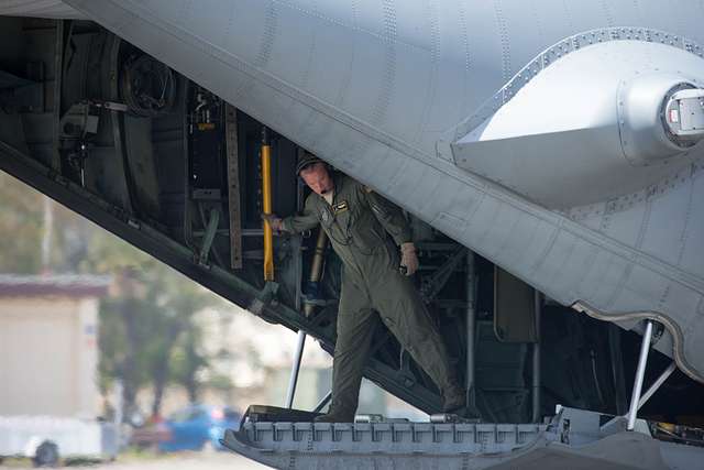 U.S. paratroopers utilizing T-11 parachutes conduct an airborne operation  from a C-130 Hercules aircraft