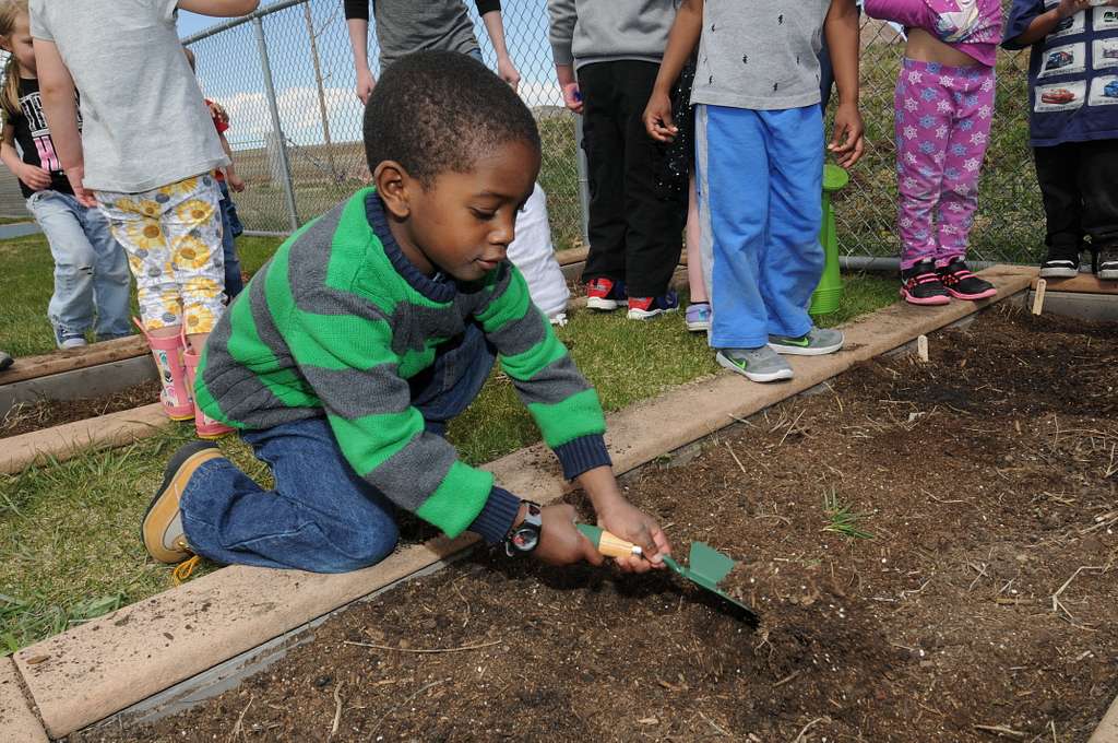 Uriah Johnson helps his preschool class dig holes in - NARA & DVIDS ...