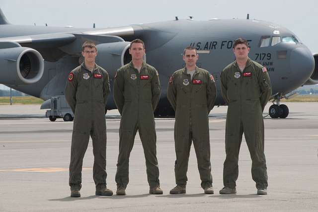 From left, U.S. Air Force Col. John Klein, 60th Air Mobility Wing  commander, former Major League Baseball player Darryl Strawberry, and Col.  Kenneth Reyes, 60th Air Mobility Wing chaplain, pose for a