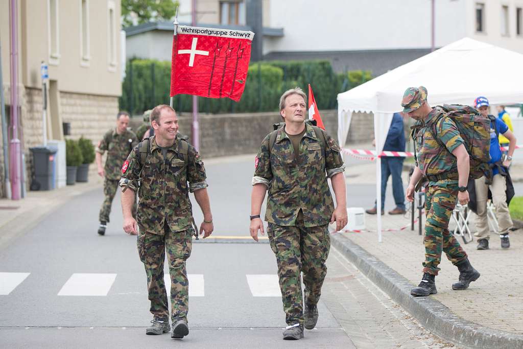 a canadian and a swiss service member cross a checkpoint 8542f7 1024