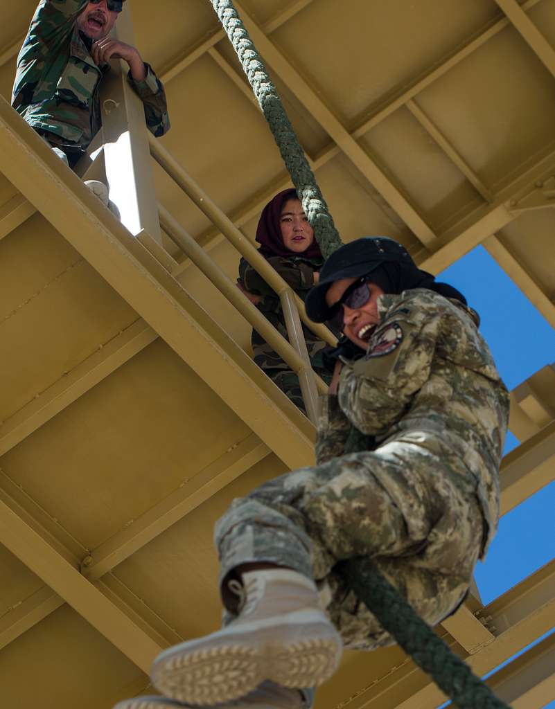 Ktah Khas Afghan Female Tactical Platoon members perform a close quarters  battle drill drill outside Kabul, Afghanistan May 29, 2016. The females  work closely alongside the males on operations to engage and