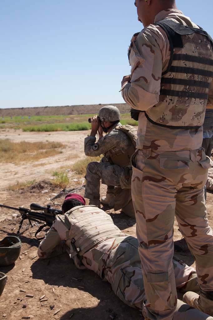 An Iraqi soldier zeroes his sniper rifle with the assistance - PICRYL ...