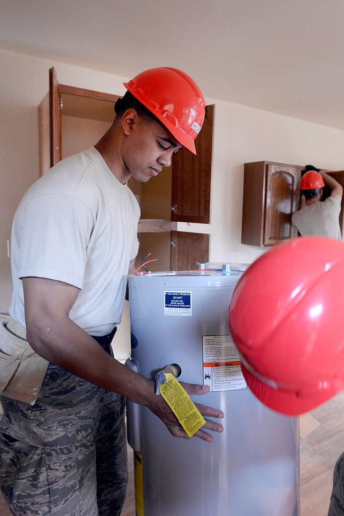 Cadet 1st Class Brodie Hicks installs a hot water heater PICRYL