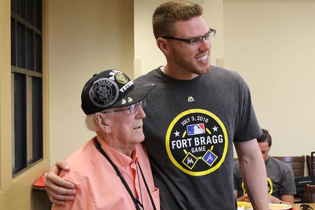 Jeff Francoeur, a player for the Atlanta Braves signs an autograph for a  military family member during a luncheon at Fort Bragg, N.C., July 3, 2016.  The event is a part of