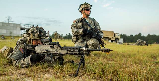 Army Spc. Stephen Drolet, a Soldier in the Massachusetts National Guard,  takes aim with a rifle during the 80-hour, Train-the-trainer Military  Funeral Honors course at Camp Smith Training Site May 11, 2017.