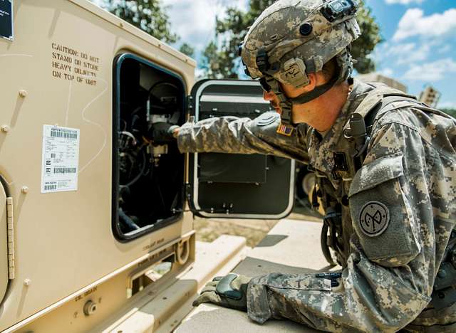 Army Spc. Stephen Drolet, a Soldier in the Massachusetts National Guard,  takes aim with a rifle during the 80-hour, Train-the-trainer Military  Funeral Honors course at Camp Smith Training Site May 11, 2017.