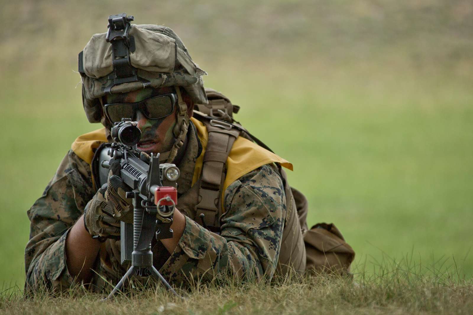 A U.S. Marine with 25th Marine Regiment lays in the - NARA & DVIDS ...