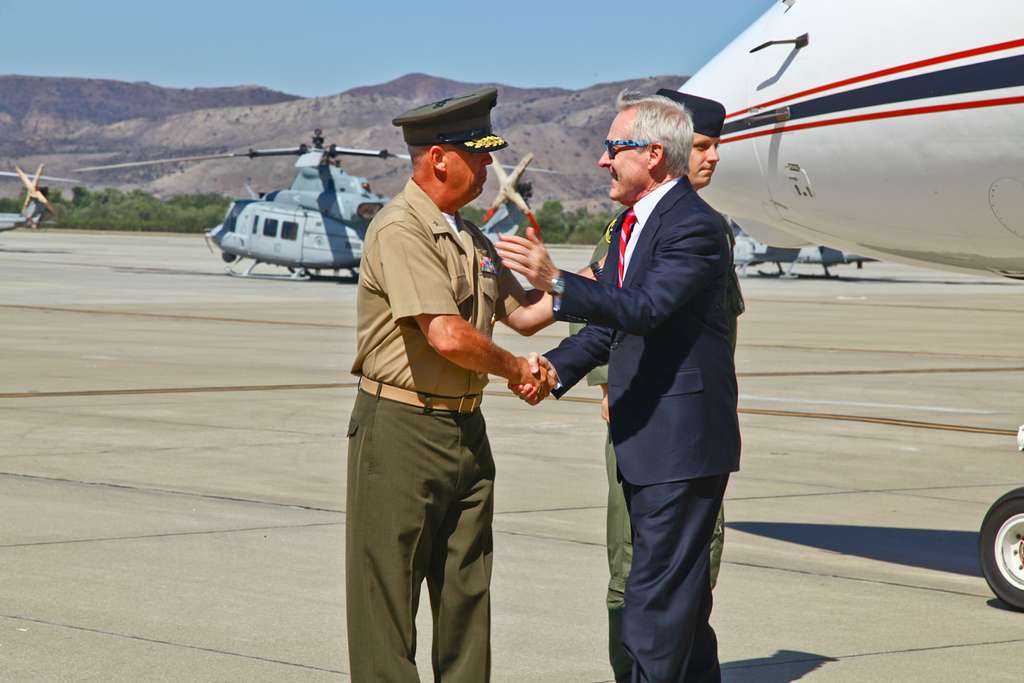 Navy Secretary Ray Mabus shakes the hands of the female service