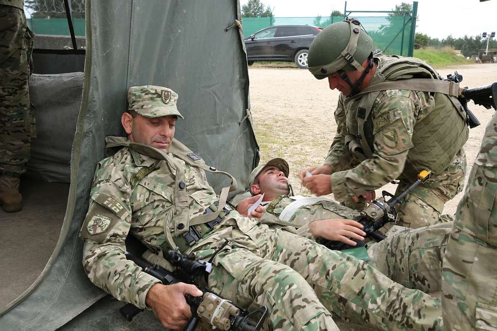 A Georgian soldier of the 32nd Infantry Battalion gives - NARA & DVIDS ...