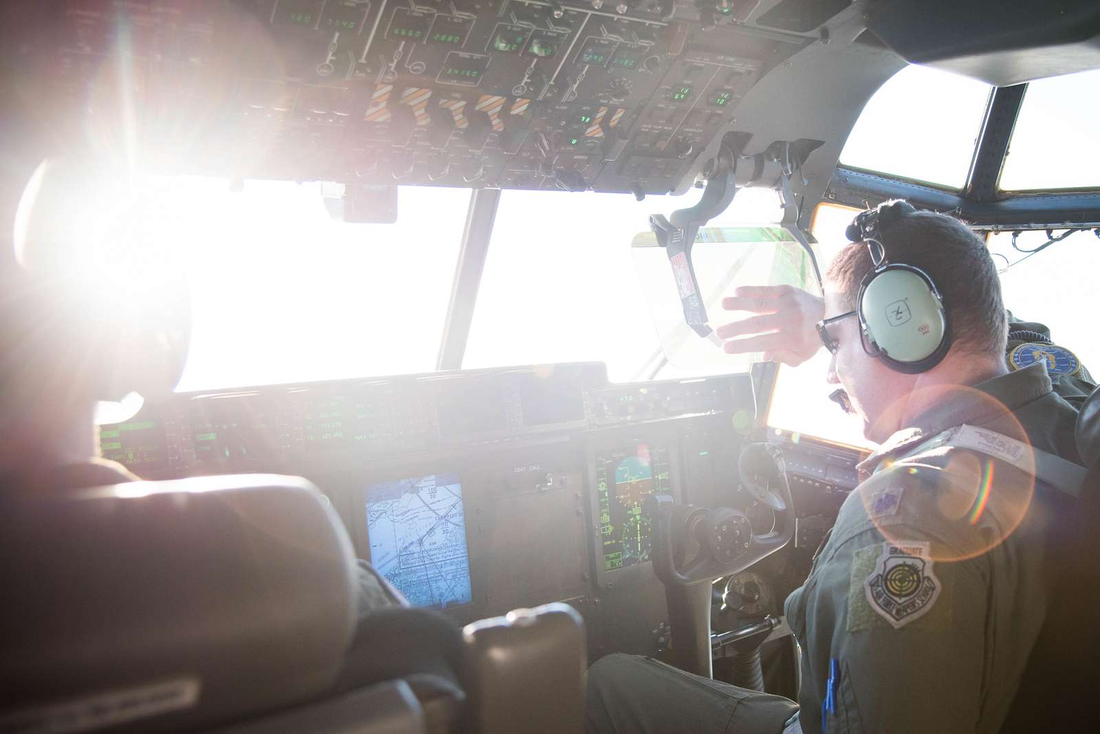 An Air Force Reserve pilot blocks the sun during an - NARA & DVIDS ...