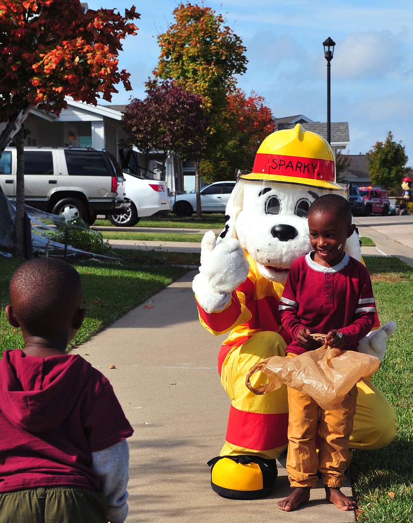 Sparky the Dog, a fire prevention mascot, hugs a Whiteman - PICRYL ...